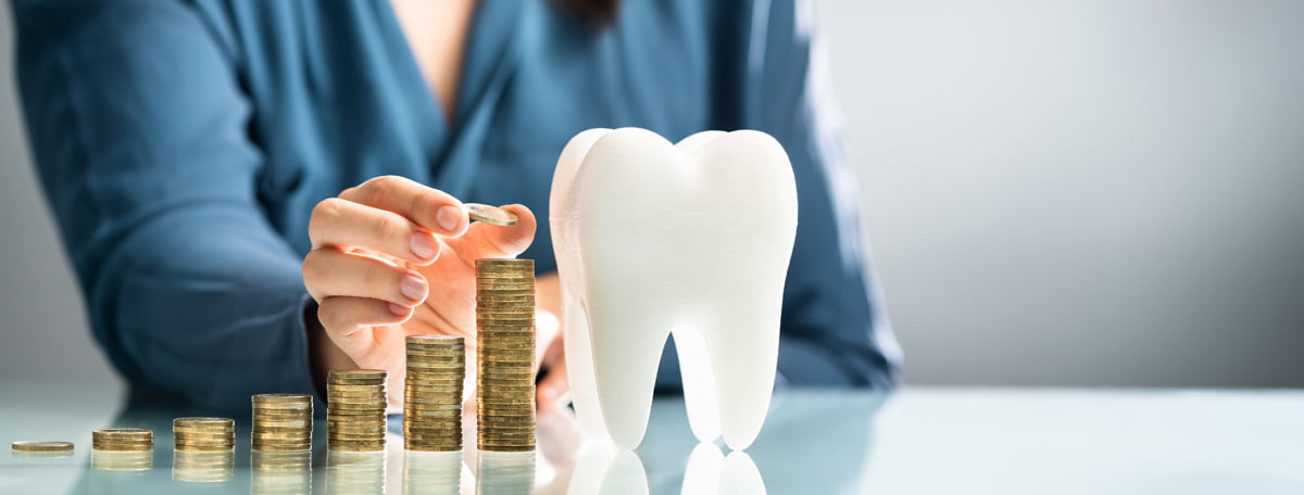 Dental insurance and direct billing concept with a patient discussing coverage options at a dental clinic