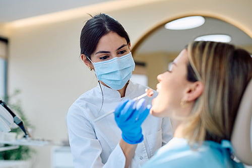 Dentist providing emergency dental care consultation to a patient at Mapleridge Dentistry in Vaughan