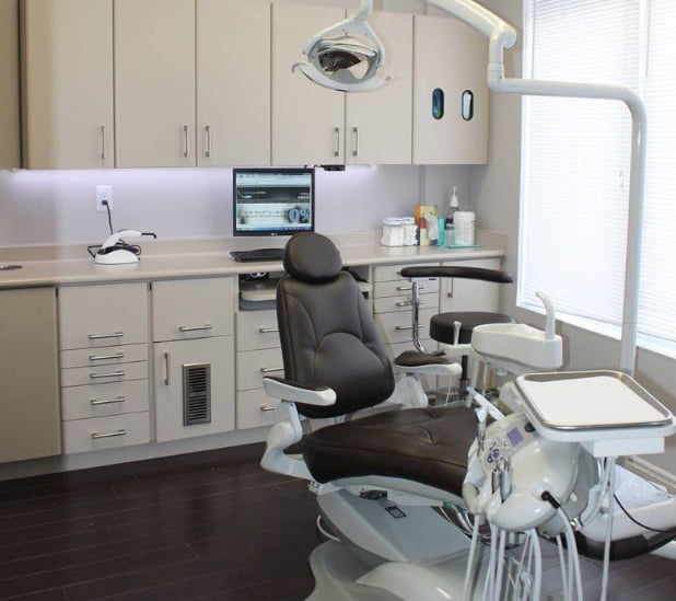 Modern dental treatment room at Mapleridge Dentistry featuring advanced dental equipment, ergonomic patient chair, and a clean clinical environment