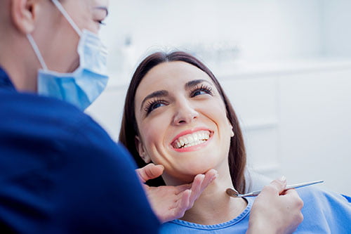 Patient meeting with a dentist to discuss whether professional teeth whitening is the right treatment option