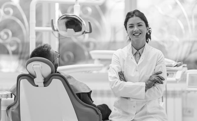 Experienced dentist discussing cosmetic dentistry options to enhance the appearance of a patient's smile.