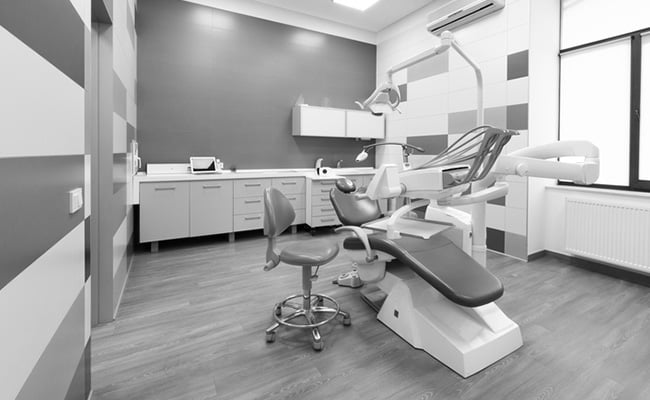 Interior of a modern dental office featuring advanced dental technology and contemporary treatment equipment.